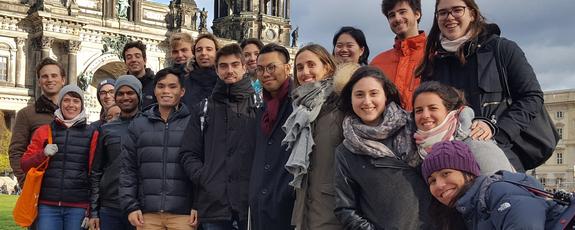 Bundled up in scarves and jackets, 18 exchange students pose for a group picture in front of the Berlin Cathedral, the magnificent domed structure on Museum Island